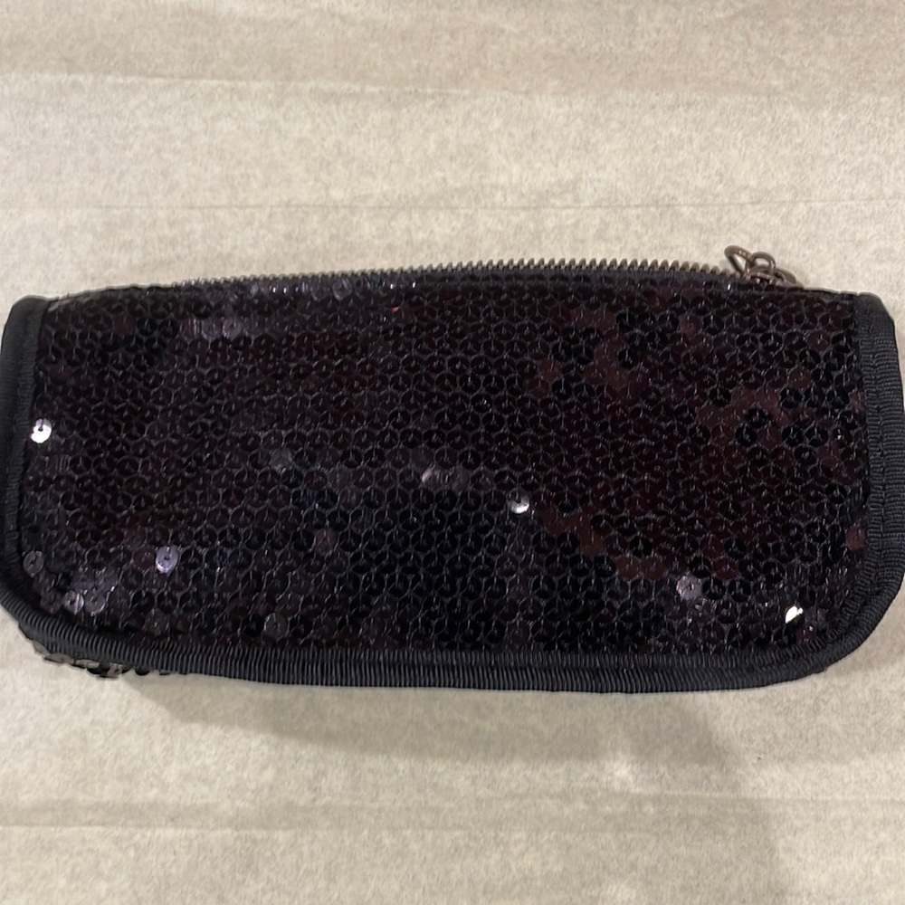 Very straightforward simple black sequin clutch by Gap 8 x 4” with top zip